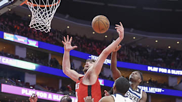 Feb 21, 2025; Houston, Texas, USA; Houston Rockets center Alperen Sengun (28) and Minnesota Timberwolves guard Anthony Edwards (5) battle for a rebound during the fourth quarter at Toyota Center. Mandatory Credit: Troy Taormina-Imagn Images
