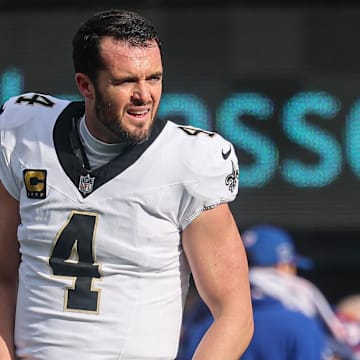 Dec 8, 2024; East Rutherford, New Jersey, USA; New Orleans Saints quarterback Derek Carr (4) warms up before the game against the New York Giants at MetLife Stadium. Mandatory Credit: Vincent Carchietta-Imagn Images
