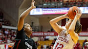 Indiana's Yarden Garzon (12) shoots over Stanford's Nunu Agara (3) during the Indiana versus Stanford women's basketball game at Simon Skjodt Assembly Hall on Sunday, Nov. 17, 2024.