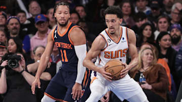 Jan 2, 2023; New York, New York, USA; Phoenix Suns guard Landry Shamet (14) looks to spin away from New York Knicks guard Jalen Brunson (11) in the fourth quarter at Madison Square Garden. Mandatory Credit: Wendell Cruz-Imagn Images