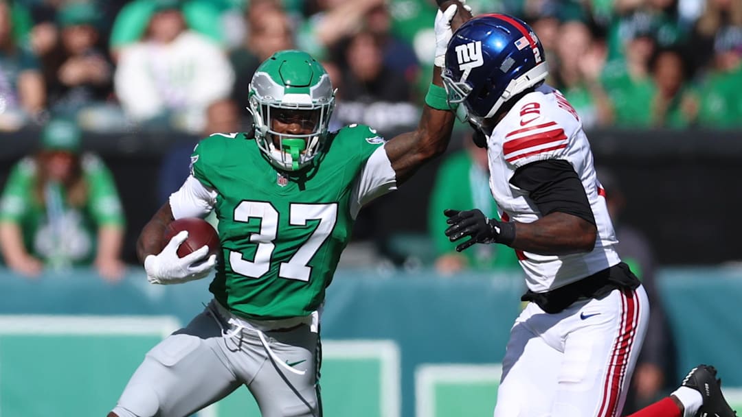 Oct 26, 2025; Philadelphia, Pennsylvania, USA; Philadelphia Eagles running back Tank Bigsby (37) runs against New York Giants cornerback Deonte Banks (2) in the first quarter at Lincoln Financial Field. Mandatory Credit: Bill Streicher-Imagn Images