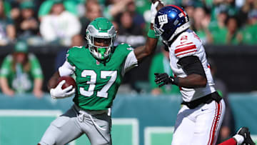 Oct 26, 2025; Philadelphia, Pennsylvania, USA; Philadelphia Eagles running back Tank Bigsby (37) runs against New York Giants cornerback Deonte Banks (2) in the first quarter at Lincoln Financial Field. Mandatory Credit: Bill Streicher-Imagn Images