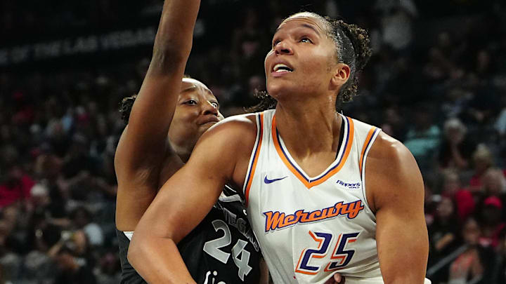 Oct 3, 2025; Las Vegas, Nevada, USA; Phoenix Mercury forward Alyssa Thomas (25) looks to shoot against Las Vegas Aces guard Jewell Loyd (24) during the second quarter of game one of the 2025 WNBA Finals at Michelob Ultra Arena. Mandatory Credit: Stephen R. Sylvanie-Imagn Images