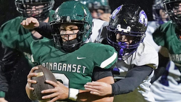 Robert Annis goes in for a tackle for the Mt. Hope varsity football team in a game against Ponagansett.