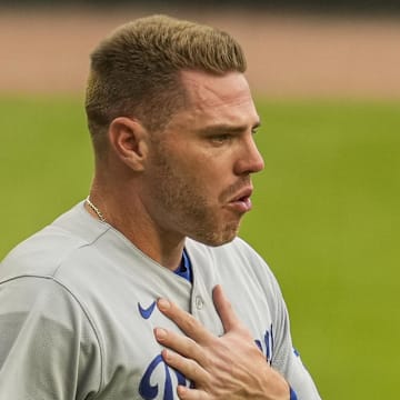 Dodgers first baseman Freddie Freeman (5) reacts with emotion as he walks on the field to receive his World Series ring from the Atlanta Braves prior to the game at Truist Park on June 24, 2022.