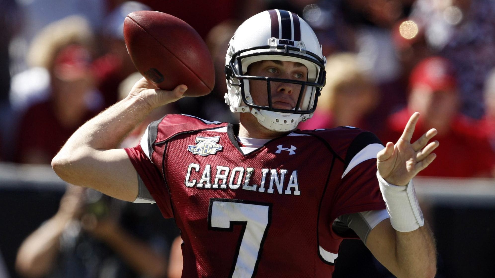 South Carolina Gamecocks quarterback Chris Smelley attempts a pass during a college football game in the SEC.