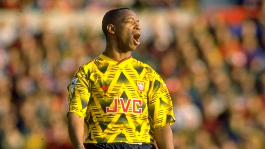 Arsenal's 'Bruised Banana' kit is worn by Ian Wright.
