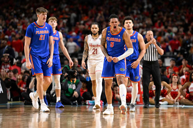 Florida's Will Richard (5) yells in celebration.
