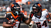 Oregon State's Clive Pond, right, attempts to tackle Montrel Hatten Jr. during the Oregon State Spring Game at Reser Stadium on Saturday, April 19, 2025, in Corvallis, Ore.