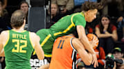 Oregon guard Jadrian Tracey fouls Oregon State forward Parsa Fallah as the Oregon State Beavers host the Oregon Ducks Thursday, Nov. 21, 2024 at Gill Coliseum in Corvallis, Ore.