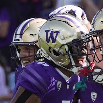 Carson Bruener and the departed Jaivion Green celebrate a play against Boise State in 2023.