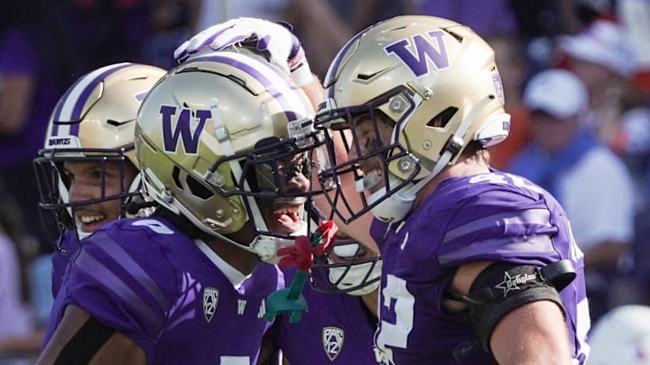 Carson Bruener and the departed Jaivion Green celebrate a play against Boise State in 2023.