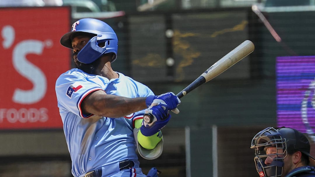 May 4, 2025; Arlington, Texas, USA;  Texas Rangers right fielder Adolis Garcia (53) hits a two-run single during the third inning against the Seattle Mariners at Globe Life Field. Mandatory Credit: Kevin Jairaj-Imagn Images