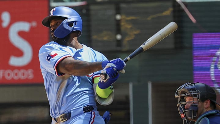 May 4, 2025; Arlington, Texas, USA; Texas Rangers right fielder Adolis Garcia (53) hits a two-run single during the third inning against the Seattle Mariners at Globe Life Field. May 4, 2025; Arlington, Texas, USA; Texas Rangers right fielder Adolis Garcia (53) hits a two-run single during the third inning against the Seattle Mariners at Globe Life Field.
