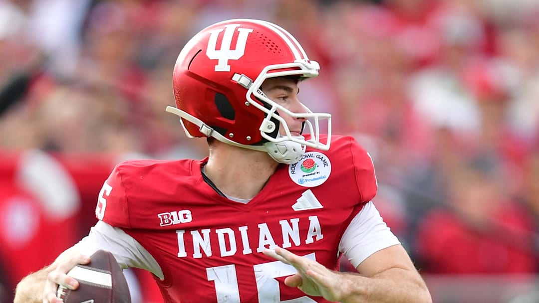 Jan 1, 2026; Pasadena, CA, USA; Indiana Hoosiers quarterback Fernando Mendoza (15) throws a pass for a touchdown against the Alabama Crimson Tide in the first half of the 2026 Rose Bowl and quarterfinal game of the College Football Playoff at Rose Bowl Stadium. Mandatory Credit: Gary A. Vasquez-Imagn Images