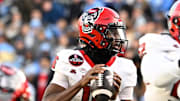 Nov 30, 2024; Chapel Hill, North Carolina, USA; North Carolina State Wolfpack quarterback CJ Bailey (16) looks to pass in the first quarter at Kenan Memorial Stadium. Mandatory Credit: Bob Donnan-Imagn Images