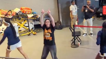 Caitlin Clark flashes a W at the Atlanta crowd. 