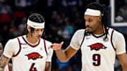 Arkansas Razorbacks Trevon Brazile (4) and Jonas Aidoo (9) congratulate each other after their win against South Carolina in a first round game at the men’s SEC Tournament in Nashville, Tenn.