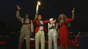 Carl Lewis, Rafael Nadal, Nadia Comaneci and Serena Williams travel with the Olympic Flame down the Seine River at the 2024 Paris Olympic Opening Ceremony.