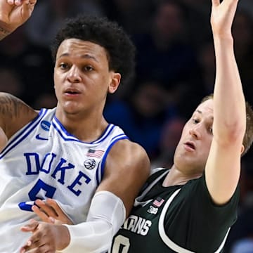 Mar 20, 2022; Greenville, SC, USA; Duke Blue Devils forward Paolo Banchero (5) passes the ball against Michigan State Spartans guard A.J. Hoggard (11) and forward Joey Hauser (10) in the second half during the second round of the 2022 NCAA Tournament at Bon Secours Wellness Arena. Mandatory Credit: Bob Donnan-Imagn Images