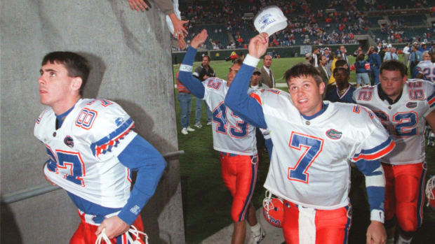  Danny Wuerffel, Florida's Quarterback, salutes fans as he leaves the field after their game against the University of Georgi