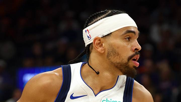 Apr 8, 2026; Phoenix, Arizona, USA; Dallas Mavericks guard Ryan Nembhard (9) against the Phoenix Suns at Mortgage Matchup Center. Mandatory Credit: Mark J. Rebilas-Imagn Images