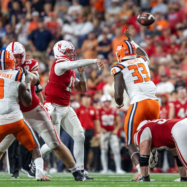 Nebraska quarterback Dylan Raiola throws a fourth-quarter pass against Illinois.