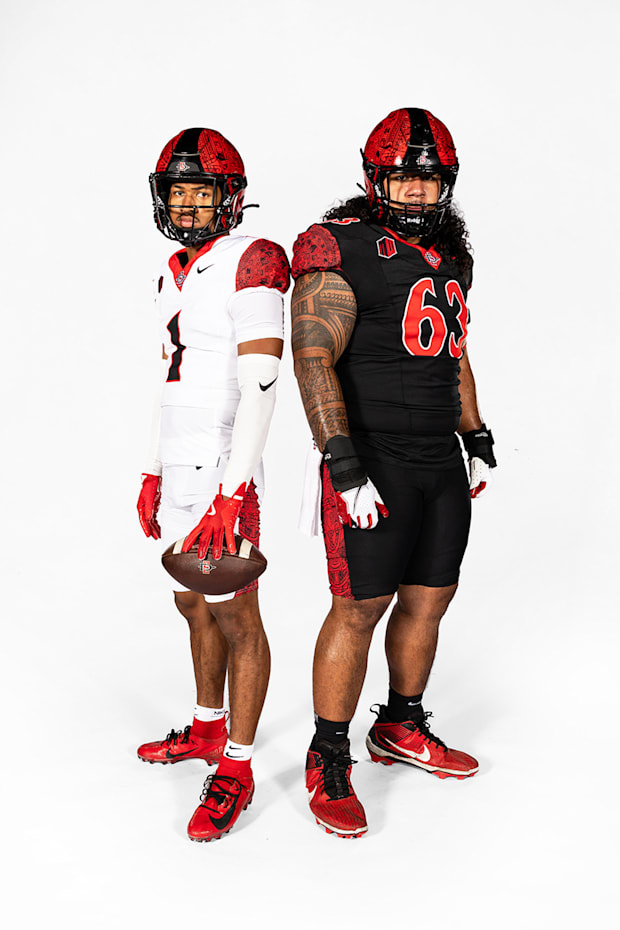 San Diego State Aztecs athletes Chris Johnson (1) and Ross Ulugalu-Maseuli (63). 