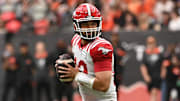 Jun 15, 2024; Vancouver, British Columbia, CAN;  Calgary Stampeders quarterback Jake Maier (12) looks to pass against the BC Lions during the first half at BC Place. Mandatory Credit: Simon Fearn-Imagn Images