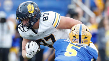 Oct 12, 2024; Pittsburgh, Pennsylvania, USA;  California Golden Bears tight end Jack Endries (87) runs after a catch as Pittsburgh Panthers defensive back Phillip O'Brien Jr. (5) defends during the second quarter at Acrisure Stadium. Mandatory Credit: Charles LeClaire-Imagn Images
