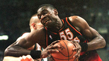 Atlanta Hawks' Dikembe Mutombo gives an elbow to D