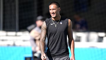 Oct 26, 2025; Charlotte, North Carolina, USA; Carolina Panthers wide receiver Tetairoa McMillan (4) warms up before a game against the Buffalo Bills at Bank of America Stadium. 