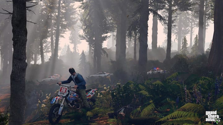 Trevor riding a bike through the woods to evade the cops in GTA 5.