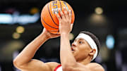 Jeremiah Fears shoots a jump shot against Michigan in a December game.