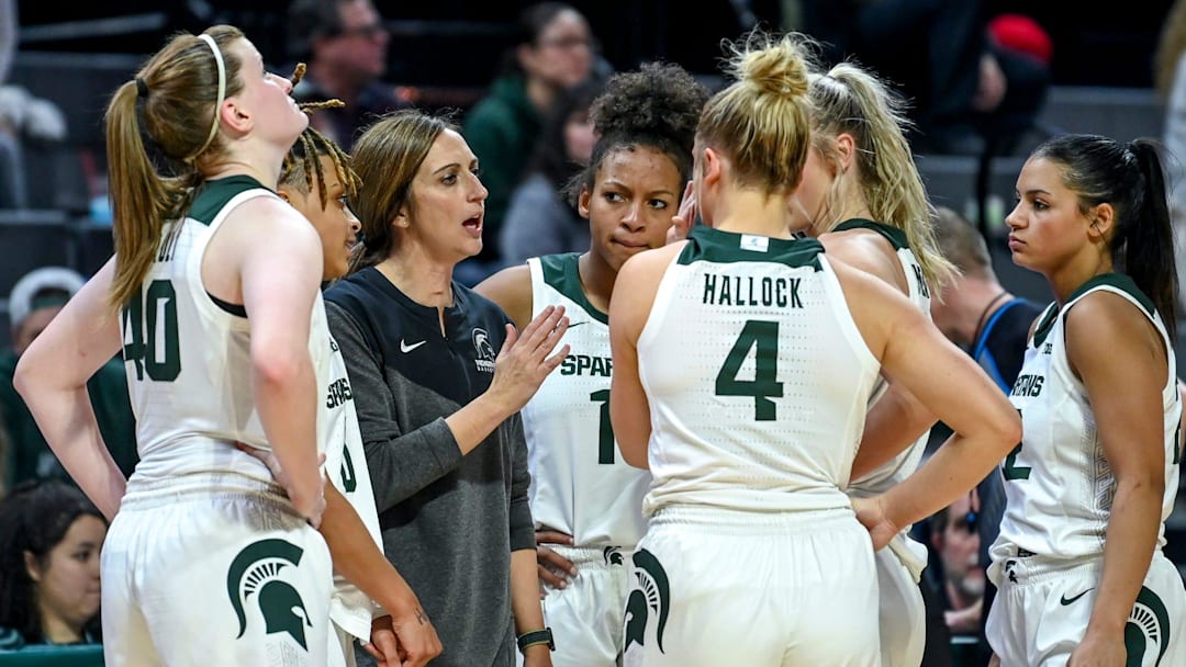Michigan State's head coach Robyn Fralick, center, talks with the team during a timeout late during the fourth quarter in the game against Maryland on Tuesday, Jan. 9, 2024, at the Breslin Center in East Lansing.