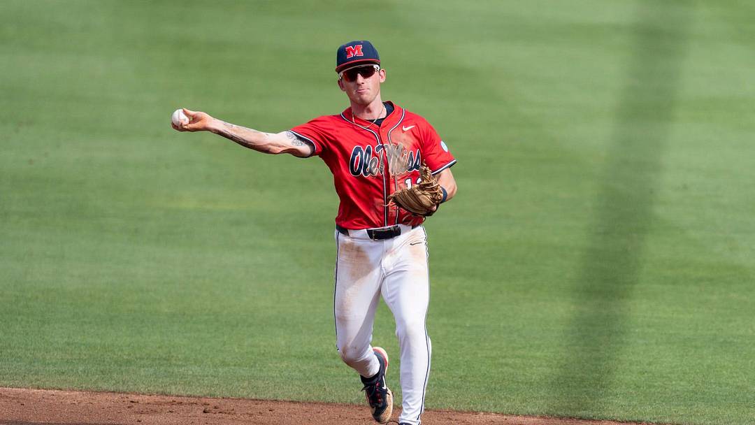 Ole Miss Rebels' Dom Decker (12) throws the ball to first base as Auburn Tigers take on Ole Miss Rebels during the NCAA Super Regional game two at Plainsman Park in Auburn, Ala. on Saturday, June 6, 2026. Ole Miss Rebels' Dom Decker (12) throws the ball to first base as Auburn Tigers take on Ole Miss Rebels during the NCAA Super Regional game two at Plainsman Park in Auburn, Ala. on Saturday, June 6, 2026.