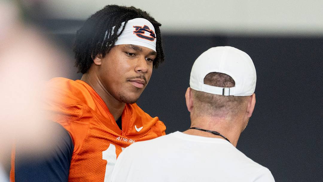 Auburn Tigers quarterback Byrum Brown (17) talks with head coach Alex Golesh during the first day of football practice at the Woltosz Football Performance Center in Auburn, Ala. on Wednesday, Aug. 5, 2026.
