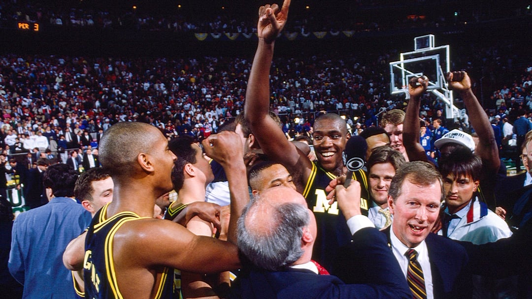 Michigan interim coach Steve Fisher and the Wolverines players celebrate after winning the 1989 NCAA men’s basketball national championship. Michigan interim coach Steve Fisher and the Wolverines players celebrate after winning the 1989 NCAA men’s basketball national championship.