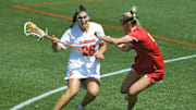 April 1, 2023, Clemson, South Carolina, USA; Clemson Tigers attack Hanna Hilcoff (26) runs near Louisville Cardinals senior Kristen Pezzullo (9) during the first quarter the Pink Game on Senior Day at Riggs Field. Mandatory Credit: Ken Ruinard - Imagn Images