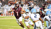 Sep 13, 2025; Blacksburg, Virginia, USA;  Virginia Tech Hokies quarterback Kyron Drones (1) runs the ball during the fourth quarter at Lane Stadium. Mandatory Credit: Brian Bishop-Imagn Images