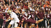 Sep 6, 2025; Blacksburg, Va.; Virginia Tech linebacker Michael Short (30) tackles Vanderbilt quarterback Diego Pavia (2) as he runs the ball.