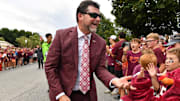 Sep 6, 2025; Blacksburg, Virginia, USA;  Virginia Tech Hokies head coach Brent Pry greets fans as he enters the stadium prior to the game at Lane Stadium. Mandatory Credit: Brian Bishop-Imagn Images