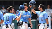 Gavin Gallaher (5) and catcher Luke Stevenson (44) celebrate the two-run homer batted by Tyson Bass (11) against Arizona in the seventh inning. The North Carolina Tarheels and the Arizona Wildcats met in game two of the NCAA Division 1 Super Regionals in Chapel Hill, N.C. on June 7, 2025.