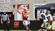 Oct 4, 2025; Blacksburg, Virginia, USA;  Virginia Tech Hokies quarterback Kyron Drones (1) throws a pass against the Wake Forest Demon Deacons during the second quarter at Lane Stadium. Mandatory Credit: Brian Bishop-Imagn Images