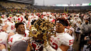 Indiana players celebrate after defeating Purdue 44-41 in double overtime to win the Old Oaken Bucket in 2019.