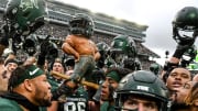 Michigan State celebrates with the Paul Bunyan Trophy after beating Michigan on Saturday, Oct. 30, 2021, at Spartan Stadium in East Lansing.

211030 Msu Michigan 257a