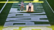 Michigan State University Assistant Sports Turf Manager Brian McDougal, left, and student assistant Nate Booth paint the end zone ahead of the opening football game on Thursday, Aug. 31, 2023, at Spartan Stadium in East Lansing.