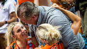 Miami (FL)'s Hanna Cavinder (15) and Haley Cavinder (14) hug their father after the second half of the NCAA Tournament Second Round game between Indiana and Miami (FL) at Simon Skjodt Assembly Hall on Monday, March 20, 2023.