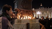 Mourners listen to prayers in St. Peter's Square at the Vatican after Pope John Paul II passed away, April 2, 2005.