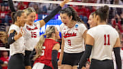 Nebraska players celebrate an ace by libero Laney Choboy against Kansas State in the second round of the NCAA Tournament.